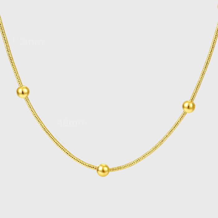 Gold necklace with spheres